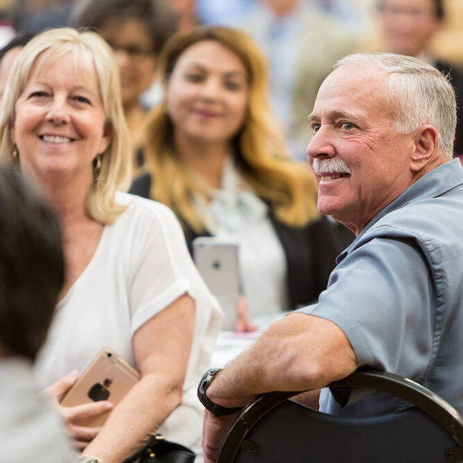 senior man and woman at a hawthorne chamber event